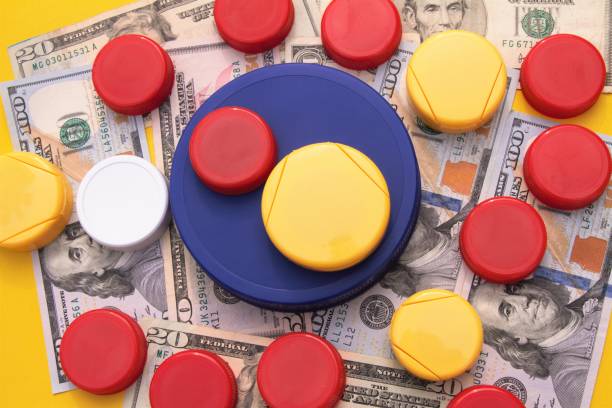 Investing concept: large cap, mid cap small cap investments. Various sized and colored caps representing Etf's, mutual funds or corporate investments. Mergers and acquisitions.