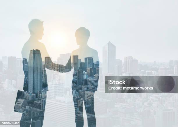 Marketing Communication Concept Silhouette Of Business Persons Shaking Hands Stock Photo - Download Image Now