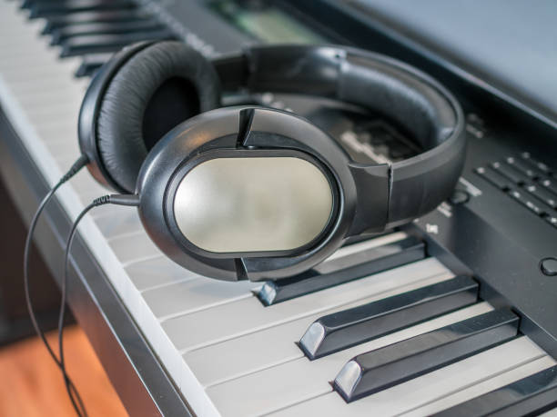 istock Clarinet lays over the digital keyboard 904426718