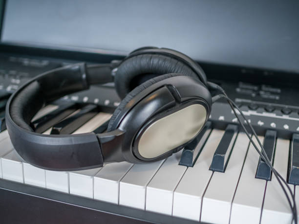 istock Clarinet lays over the digital keyboard 904426720
