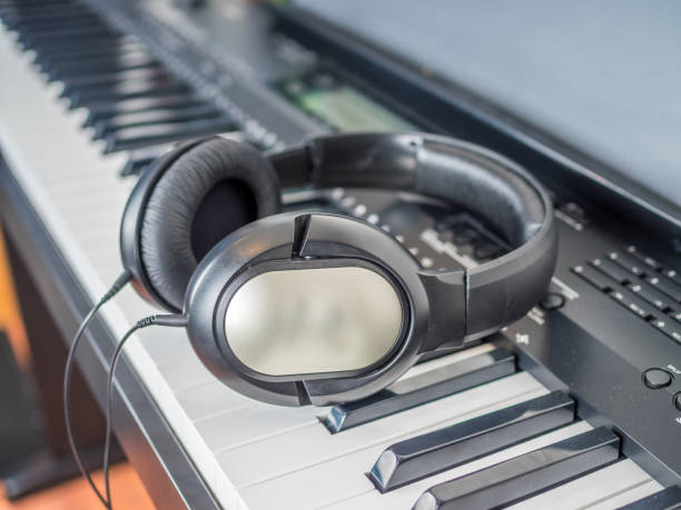istock Clarinet lays over the digital keyboard 904426738