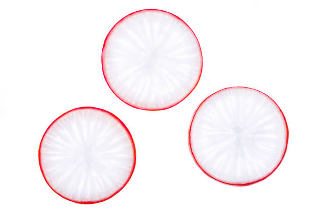 istock Radish slices isolated on white background 904434330