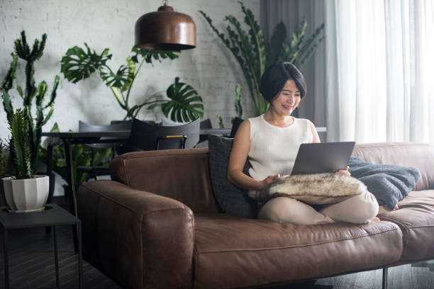 istock Young Asian woman working at home. 904434584