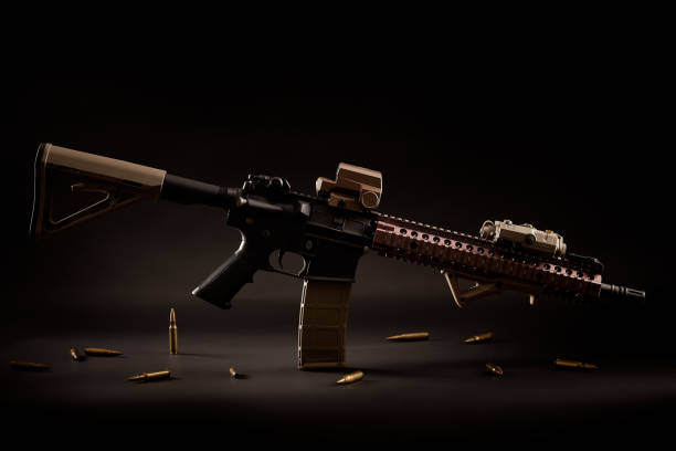 Assault Rifle And Golden Bullets On A Black Background Stock Photo -  Download Image Now - iStock