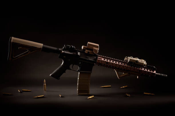 Assault Rifle And Golden Bullets On A Black Background Stock Photo - Download Image Now - iStock Assault Rifle And Golden Bullets On A Black Background Stock Photo - Download Image Now - iStock