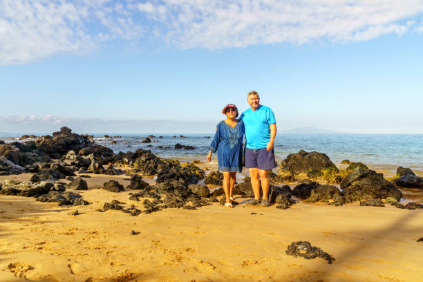 istock Senior couple together on Maui beach 904437912