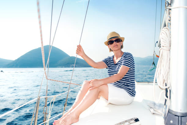 istock Woman Enjoying Sea on Sailboat 904445008