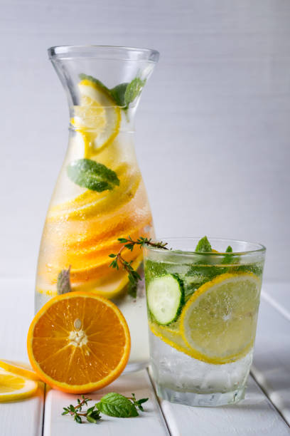 istock Fruit and herb infused water. Cold refreshing vitamin detox water 904448478