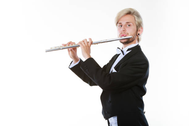 istock Male flutist wearing tailcoat plays flute 904453586