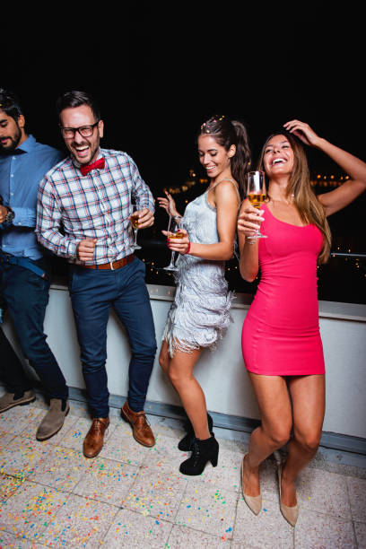 istock Group of people having a party on the roof 904459758