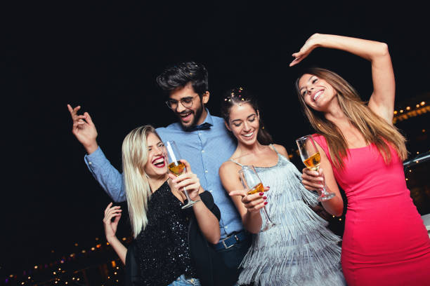istock Group of people having a party on the roof 904459968