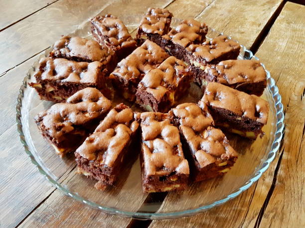 istock Chocolate-apple cake on the glass plate on the wooden table. 904459978