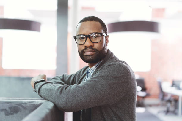 istock Portrait of businessman by cubicle in office 904460310