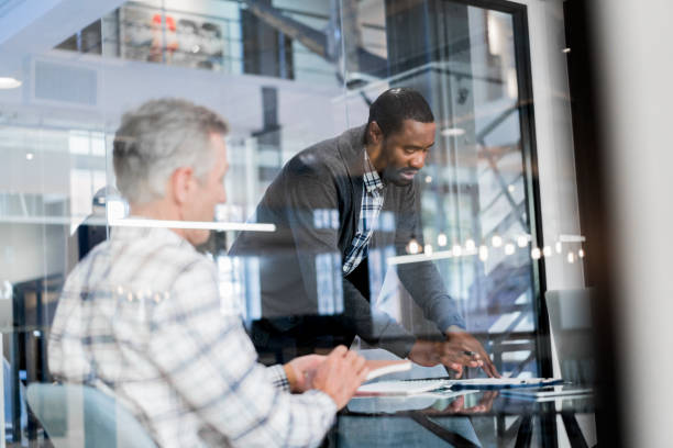 istock Businessmen discussing at conference meeting 904464074
