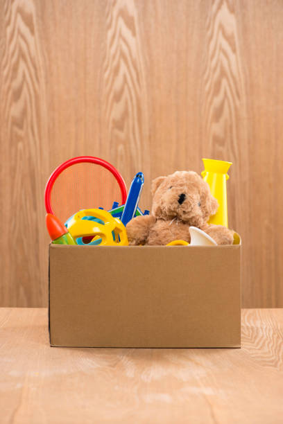 istock Toy. Donation box with  unwanted items for poor 904466104