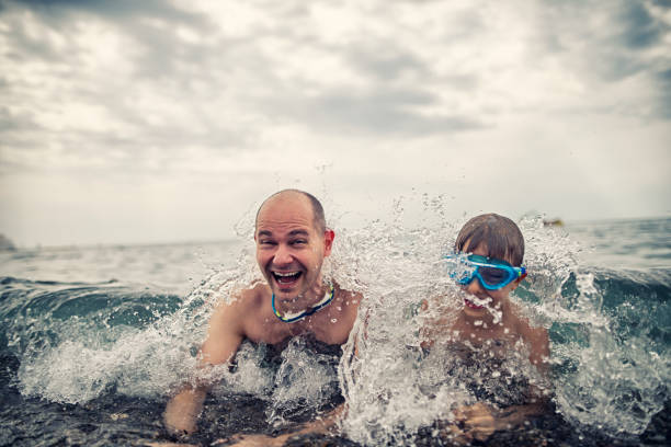Funny couple films themselves in the raging Baltic Sea waves