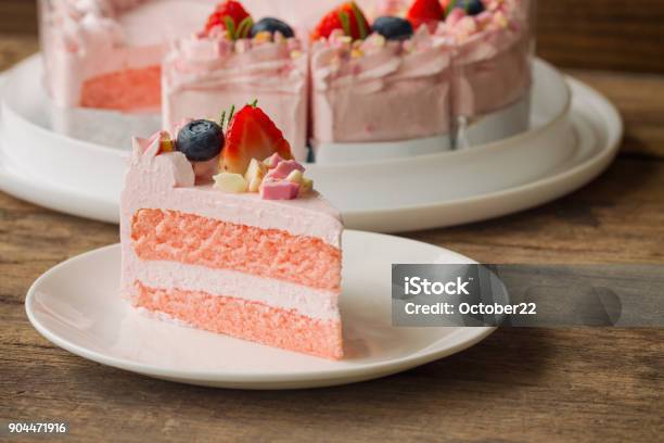 White Chocolate Strawberry Yogurt Cake Decorated With Fresh Fruits And Chocolate Chunk On Wood Table Delicious And Sweet Pink Cake For Valentines Or Birthday Party Homemade Bakery Concept Stock Photo - Download Image Now