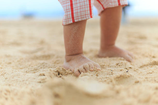 istock A baby legs on a beach 904472532