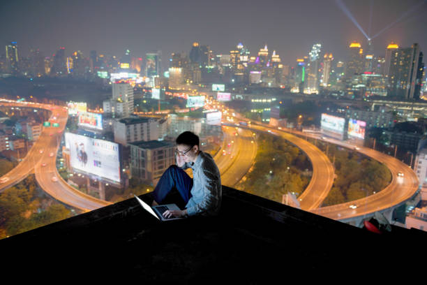 istock Asian businessman using phone and laptop with city  background, technology communication concept 904472618