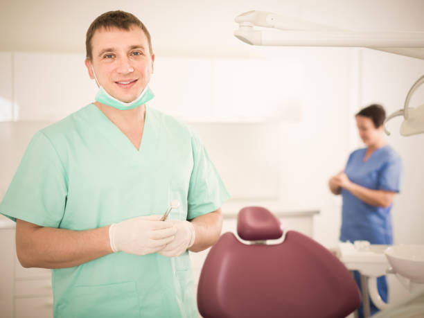 istock Adult doctor dentist in uniform 904472692