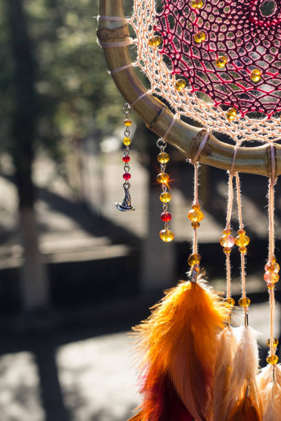 istock Handmade dream catcher with feathers threads and beads rope hanging 904472776