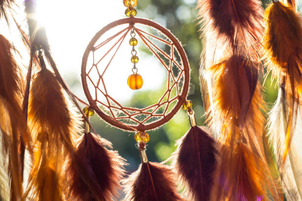 istock Handmade dream catcher with feathers threads and beads rope hanging 904472970