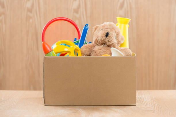 istock Toy. Donation box with  unwanted items for poor 904475260