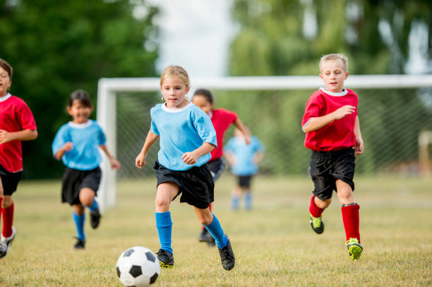 istock Girl Playing Soccer 904476244