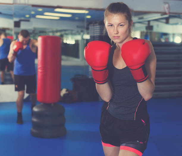 istock Woman boxing in gym 904476300