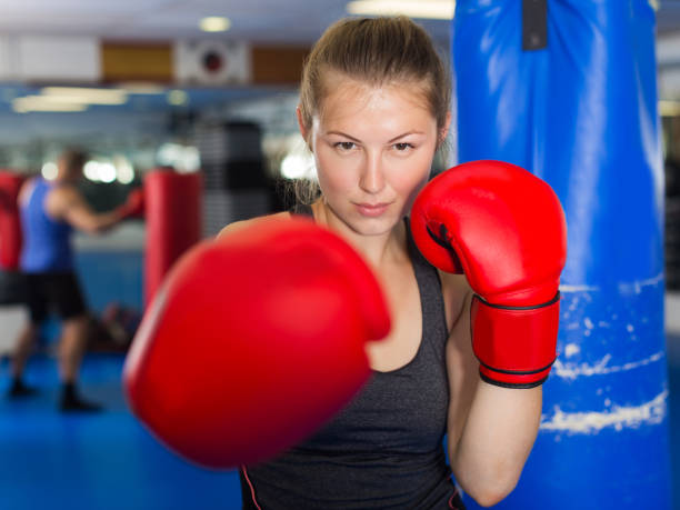 istock Portrait of woman boxer 904476320