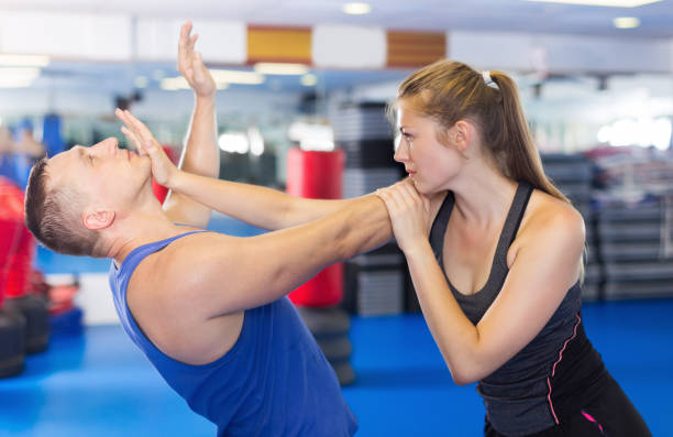 istock Young woman and her trainer are practicing captures 904476344