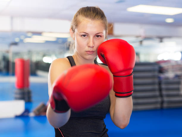 istock Woman boxing in gym 904476528