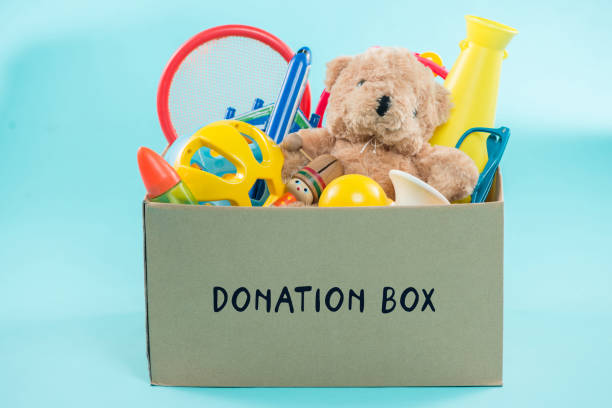 istock Toy. Donation box with  unwanted items for poor 904479064