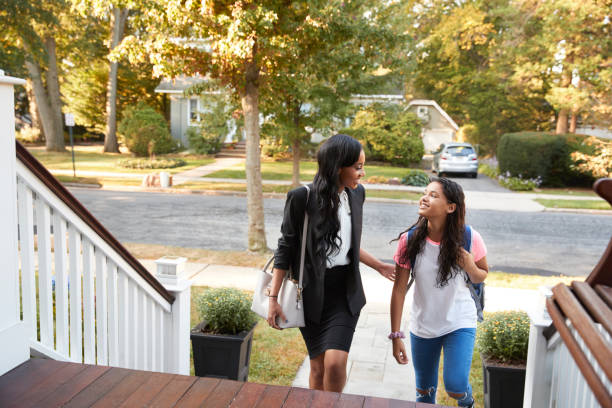 istock Business Couple Leaving Suburban House For Commute To Work 904479934