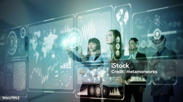 Group Of People Operating Futuristic Gui Stock Photo - Download Image Now - Virtual Reality, Virtual Reality Simulator, Touch Screen