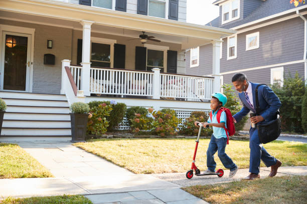 istock Businessman Father Walking Son On Scooter To School 904480038