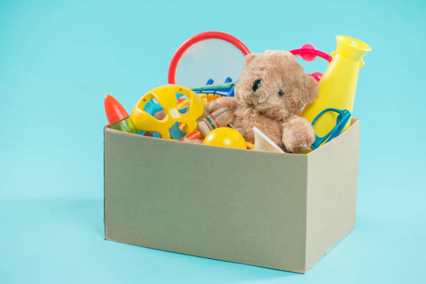 istock Toy. Donation box with  unwanted items for poor 904480096