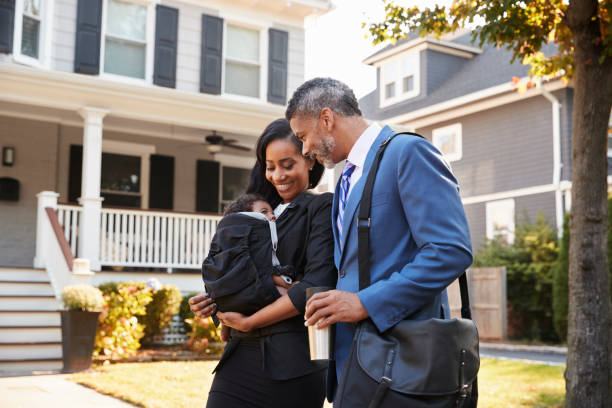 istock Business Couple With Baby Son Leaving House For Work 904480182