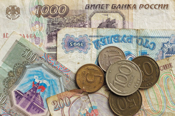 The ruble lies on 10,000 thousand tenge banknotes.