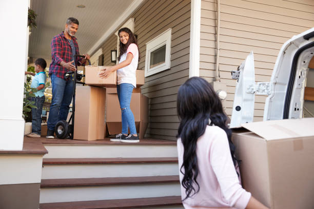 istock Children Helping Children With Boxes On Moving In Day 904483690