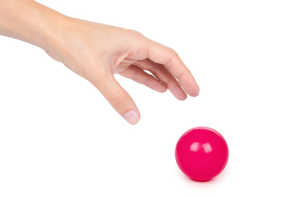 istock ping-pong ball in hand isolated on white background 904486480