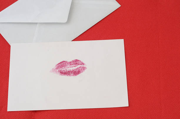 istock Red love background, letter with a red kiss 904487282