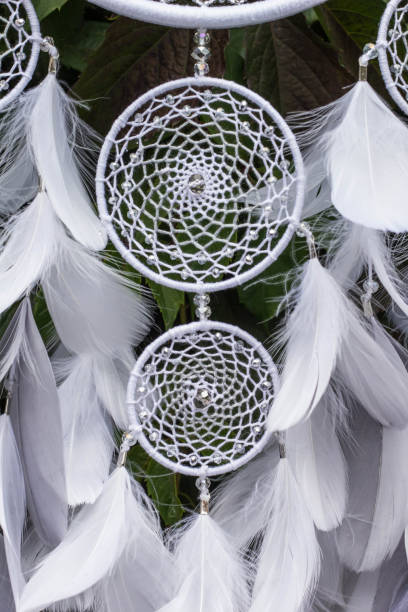 istock Handmade dream catcher with feathers threads and beads rope hanging 904487424