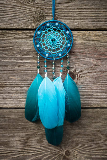 istock Handmade dream catcher with feathers threads and beads rope hanging 904487460