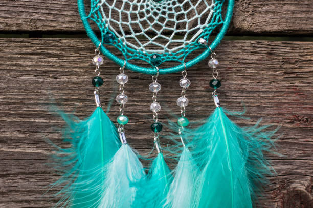 istock Handmade dream catcher with feathers threads and beads rope hanging 904487484
