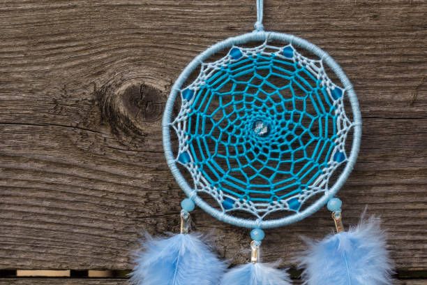 istock Handmade dream catcher with feathers threads and beads rope hanging 904487502