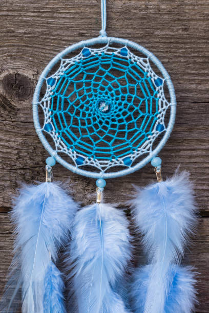 istock Handmade dream catcher with feathers threads and beads rope hanging 904487568