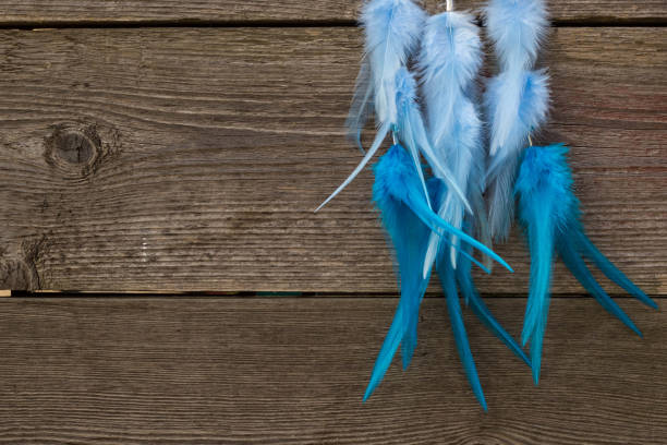 istock Handmade dream catcher with feathers threads and beads rope hanging 904487572