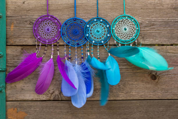 istock Handmade dream catcher with feathers threads and beads rope hanging 904487586