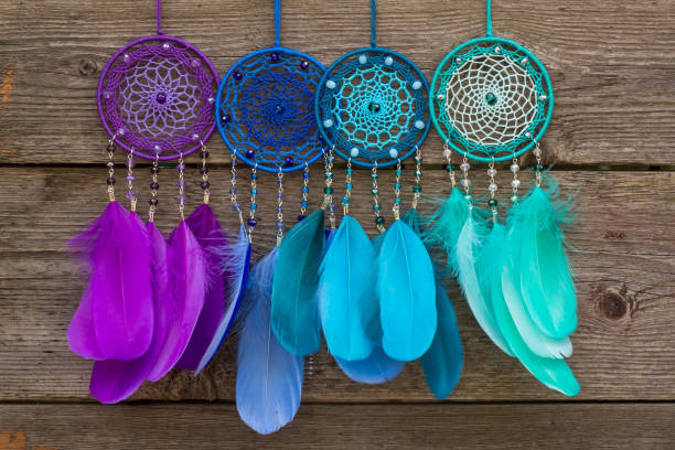 istock Handmade dream catcher with feathers threads and beads rope hanging 904487840